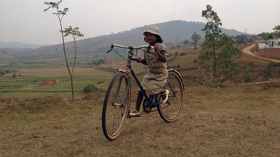 Malagase Kid in Bicycle, Madagascar